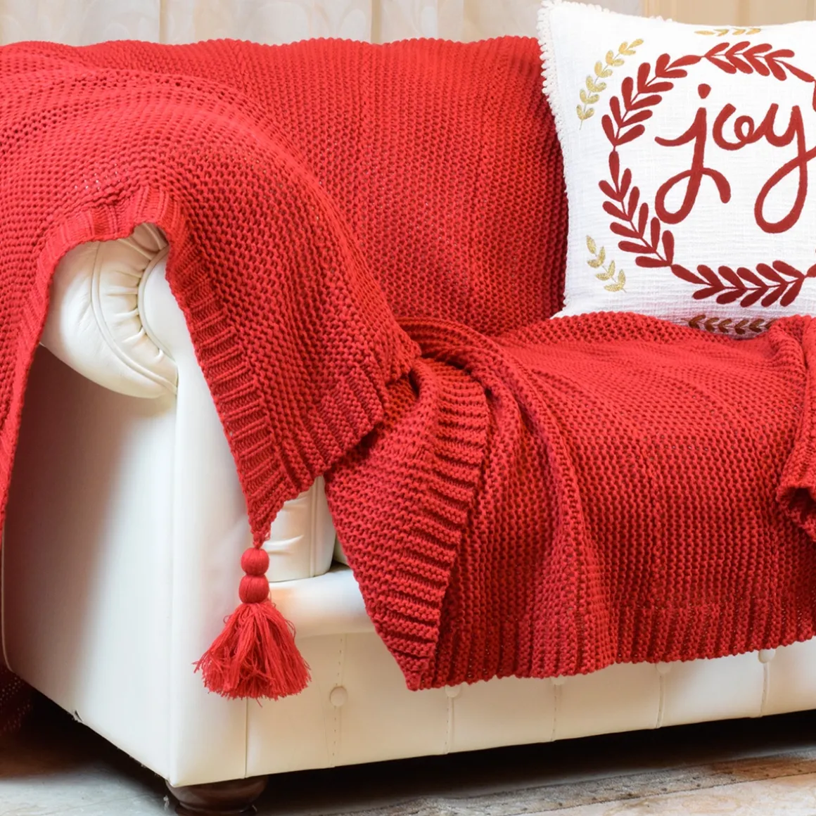 coperta_in_maglia_con_nap_0.webp Coperta in maglia con nappe