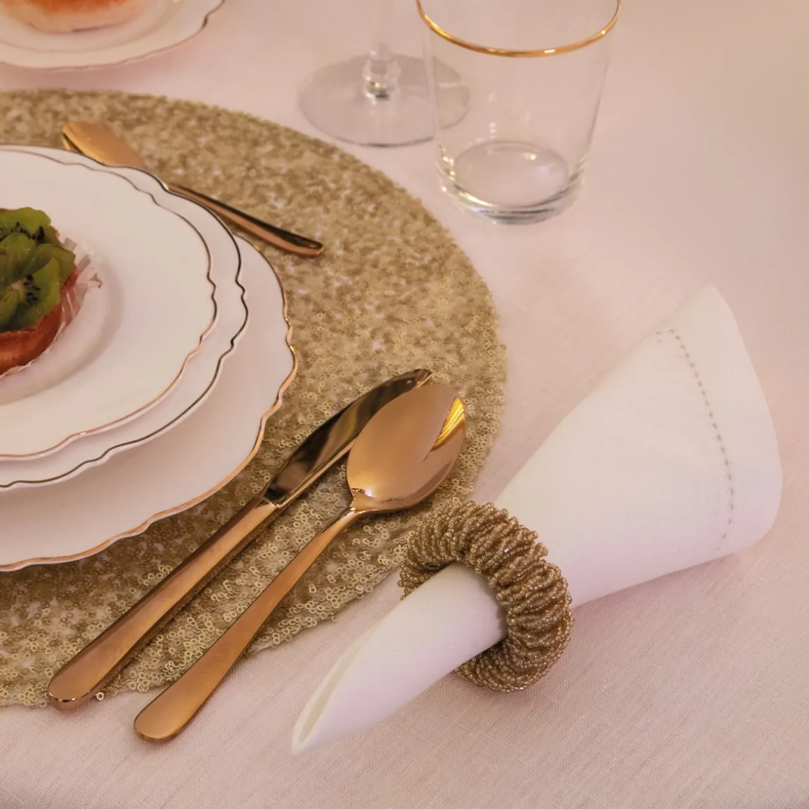 set_pz_legatovagliolo_in__1.webp Set 4pz legatovagliolo in perline oro